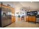Kitchen view with stainless steel appliances and open to the living room at 15141 Farm Rd, Groveland, FL 34736