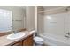 Bathroom with a single sink vanity, tile flooring, and a bathtub with a shower at 1667 Osprey Ave, The Villages, FL 32162