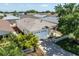 Home exterior featuring attached garage, well-maintained yard, and landscaping at 1667 Osprey Ave, The Villages, FL 32162