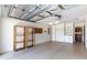 Spacious garage with shelving and plenty of storage space at 1667 Osprey Ave, The Villages, FL 32162