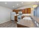 Kitchen showcases updated lighting and solid surface countertops at 1667 Osprey Ave, The Villages, FL 32162