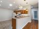 Kitchen features a breakfast bar and updated lighting fixtures at 1667 Osprey Ave, The Villages, FL 32162