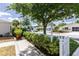 Picturesque street view featuring well-kept homes with white picket fences and lush greenery, creating a welcoming community vibe at 1667 Osprey Ave, The Villages, FL 32162
