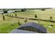 Aerial view showcasing the screened lanai, expansive backyard, and scenic surroundings at 1688 Littleleaf Boxwood Loop, Mascotte, FL 34753