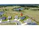Residential neighborhood, featuring modern homes with spacious lawns and a backdrop of natural ponds and picturesque landscapes at 1688 Littleleaf Boxwood Loop, Mascotte, FL 34753