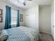 Bright bedroom with a window, closet, light colored walls, and neutral carpet at 1688 Littleleaf Boxwood Loop, Mascotte, FL 34753