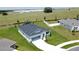 Aerial view of a well-maintained single-Gathering home with a spacious lawn and manicured landscaping at 1688 Littleleaf Boxwood Loop, Mascotte, FL 34753