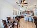 Spacious kitchen with stainless steel appliances, wood cabinets, and a dining area at 1688 Littleleaf Boxwood Loop, Mascotte, FL 34753