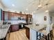 Elegant kitchen features granite countertops, stainless steel appliances, and ample cabinet space at 1688 Littleleaf Boxwood Loop, Mascotte, FL 34753