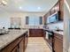 Stylish kitchen with granite countertops, stainless steel appliances, and plenty of storage at 1688 Littleleaf Boxwood Loop, Mascotte, FL 34753