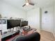 Home office with desk, shelving, and two monitors at 1688 Littleleaf Boxwood Loop, Mascotte, FL 34753
