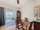 Cozy dining room with a patio view and sliding glass doors to the outside at 1688 Littleleaf Boxwood Loop, Mascotte, FL 34753