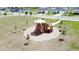 Community playground and equipment in a meticulously maintained green space, perfect for Gathering activities at 1688 Littleleaf Boxwood Loop, Mascotte, FL 34753