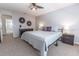 Spacious primary bedroom featuring neutral carpet and decor with a ceiling fan and plenty of space at 1704 Hoofprint Court, Fruitland Park, FL 34731