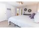 Comfortable bedroom with grey walls and multiple doors that is neatly decorated and inviting at 1704 Hoofprint Court, Fruitland Park, FL 34731