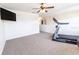 Versatile bonus room featuring a treadmill and TV, perfect for a home gym or entertainment area at 1704 Hoofprint Court, Fruitland Park, FL 34731