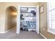 Organized closet with shelving, storage containers, and hanging space, maximizing storage solutions at 1704 Hoofprint Court, Fruitland Park, FL 34731
