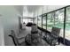 Enclosed patio with a dining table and chairs, perfect for outdoor entertaining at 1704 Hoofprint Court, Fruitland Park, FL 34731