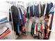 Well-organized walk-in closet with hanging racks and shelves, providing ample storage for clothing at 1704 Hoofprint Court, Fruitland Park, FL 34731