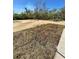 Expansive undeveloped backyard with trees and hose, awaiting landscaping at 17459 Sw 17Th Cir, Ocala, FL 34473