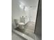 New bathroom with double vanity, toilet, and glass-enclosed marble look shower at 17459 Sw 17Th Cir, Ocala, FL 34473