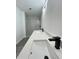 Modern bathroom featuring a double vanity with dark fixtures and marble-look shower at 17459 Sw 17Th Cir, Ocala, FL 34473