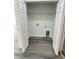 Closet with double doors, wire shelving, and utility hook-ups for laundry at 17459 Sw 17Th Cir, Ocala, FL 34473