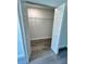 Open closet with wire shelving and attractive wood-look flooring at 17459 Sw 17Th Cir, Ocala, FL 34473