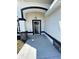Inviting entryway highlighting stone pillars and a modern, arched doorway design at 17459 Sw 17Th Cir, Ocala, FL 34473