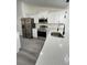 Well-equipped kitchen with stainless steel appliances and a center island with quartz countertop at 17459 Sw 17Th Cir, Ocala, FL 34473