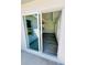 View from patio through sliding glass doors to living area with modern finishes at 17459 Sw 17Th Cir, Ocala, FL 34473