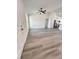 Bright living room featuring hardwood floors, a modern ceiling fan and views of the kitchen at 17459 Sw 17Th Cir, Ocala, FL 34473