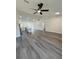 Spacious living room with lots of natural light, hardwood floors and views to the kitchen at 17459 Sw 17Th Cir, Ocala, FL 34473