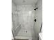 New shower features a seat, white marble-look tile surround and hexagon floor tiles at 17459 Sw 17Th Cir, Ocala, FL 34473