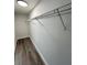 Walk-in closet features wire shelving and vinyl floors under recessed lighting at 17459 Sw 17Th Cir, Ocala, FL 34473