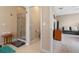 Bright bathroom features a glass enclosed shower, tile flooring, and neutral wall color at 17519 Promenade Dr, Clermont, FL 34711