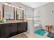 Elegant bathroom features double sinks, a tub, and updated fixtures at 17519 Promenade Dr, Clermont, FL 34711