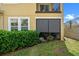 Exterior view of the house with a window and plants at 17519 Promenade Dr, Clermont, FL 34711