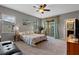 Spacious main bedroom with balcony access and ensuite bathroom at 17519 Promenade Dr, Clermont, FL 34711