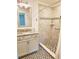 Updated bathroom features modern tile shower, stylish vanity, and neutral color palette at 1765 Hilltop Dr, Mount Dora, FL 32757