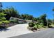 Exterior view of home with long driveway and lush landscaping at 1765 Hilltop Dr, Mount Dora, FL 32757