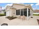 Inviting home featuring a screened in porch, perfect for relaxing and enjoying the outdoors at 1833 Endsley Ct, The Villages, FL 32162