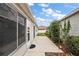 Extended concrete patio for relaxation, leading to the house, offering ample space at 1833 Endsley Ct, The Villages, FL 32162