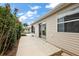 Back patio is perfect for outdoor relaxation, providing space for seating and gardening at 1833 Endsley Ct, The Villages, FL 32162
