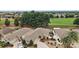 An aerial view of a lovely single-Gathering home with a well-manicured lawn in a desirable community near a golf course at 2064 Edenton Ter, The Villages, FL 32162