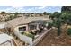 Enclosed porch area in a single-Gathering home featuring an enclosed porch area and landscaped surroundings at 2064 Edenton Ter, The Villages, FL 32162