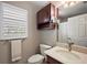 Bathroom with a single sink vanity, mirrored cabinet, and shower-tub combination at 2064 Edenton Ter, The Villages, FL 32162