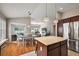Open dining area with access to a screened patio, adjacent to the kitchen and living room at 2064 Edenton Ter, The Villages, FL 32162
