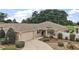 Charming home exterior with well-manicured landscaping and inviting entrance at 2064 Edenton Ter, The Villages, FL 32162