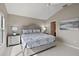 Cozy primary bedroom with neutral color scheme and ensuite bathroom access at 2064 Edenton Ter, The Villages, FL 32162